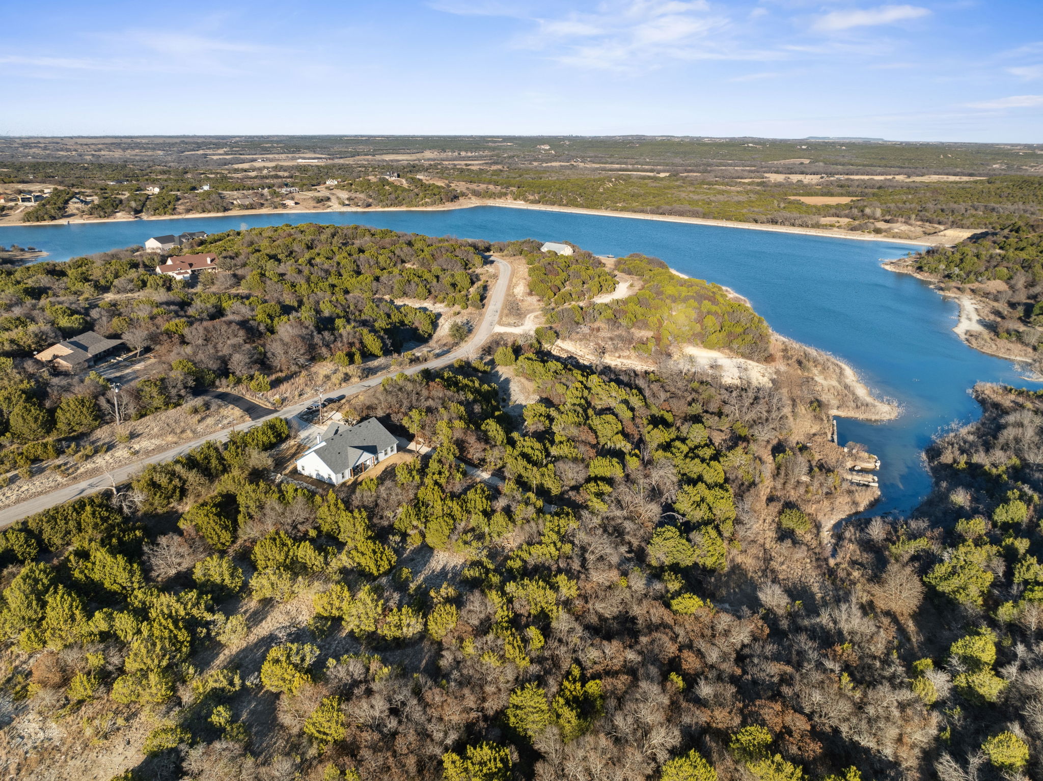 Drone shot of a house in Bluff Dale with the lake in the background